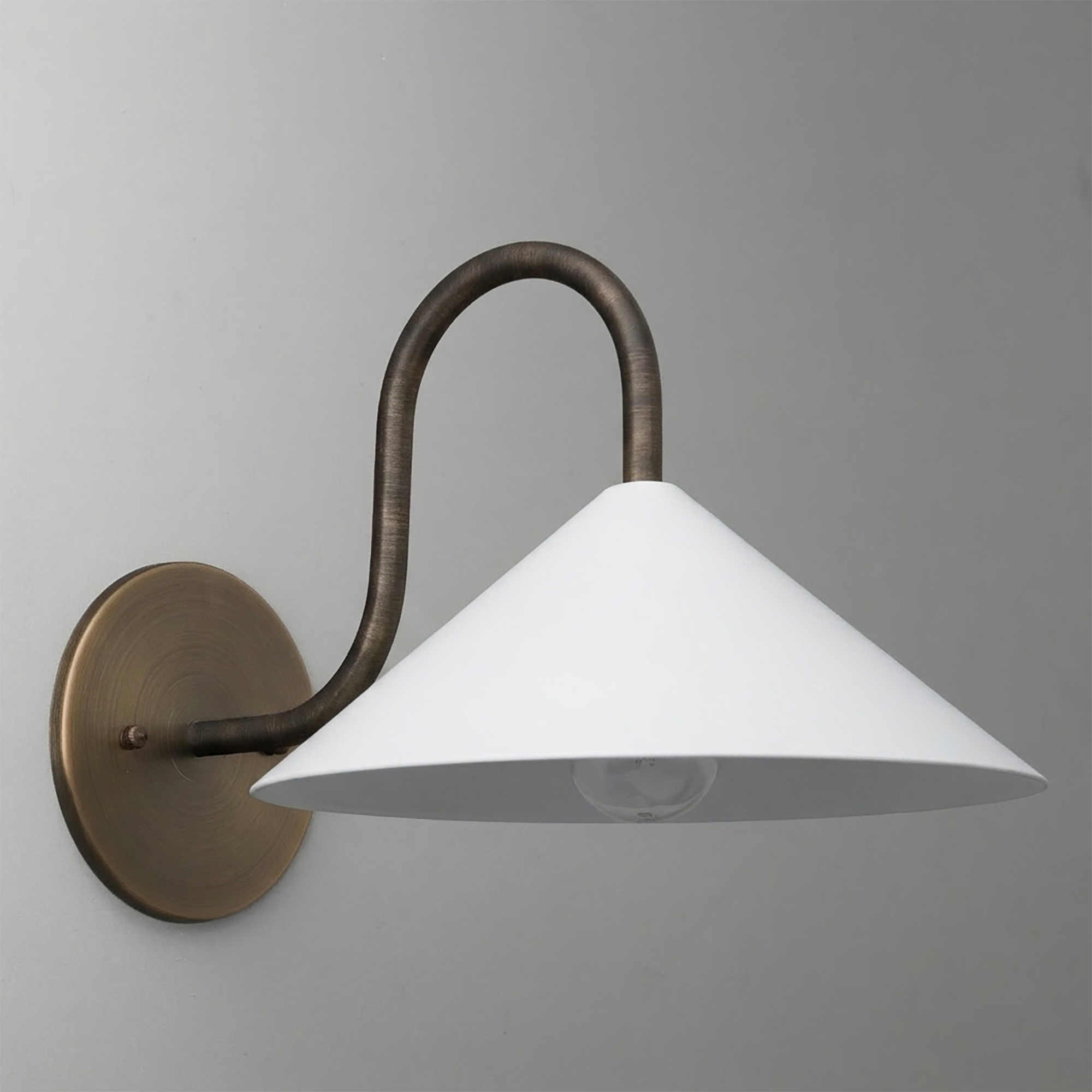 Wall-mounted sconce with curved bronze arm and wide white conical metal shade. - SCONCE MODEL NO. 1015