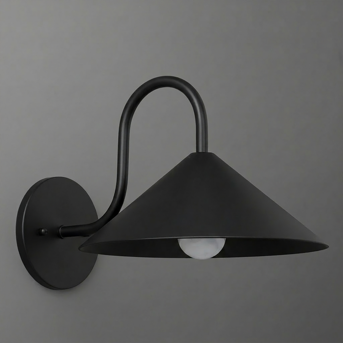 Black metal wall sconce with a wide conical shade and curved arm holding one exposed bulb. - SCONCE MODEL NO. 1015