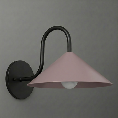 Matte black metal wall sconce with a curved arm and a wide, dusty pink conical shade covering one bulb. - SCONCE MODEL NO. 1015