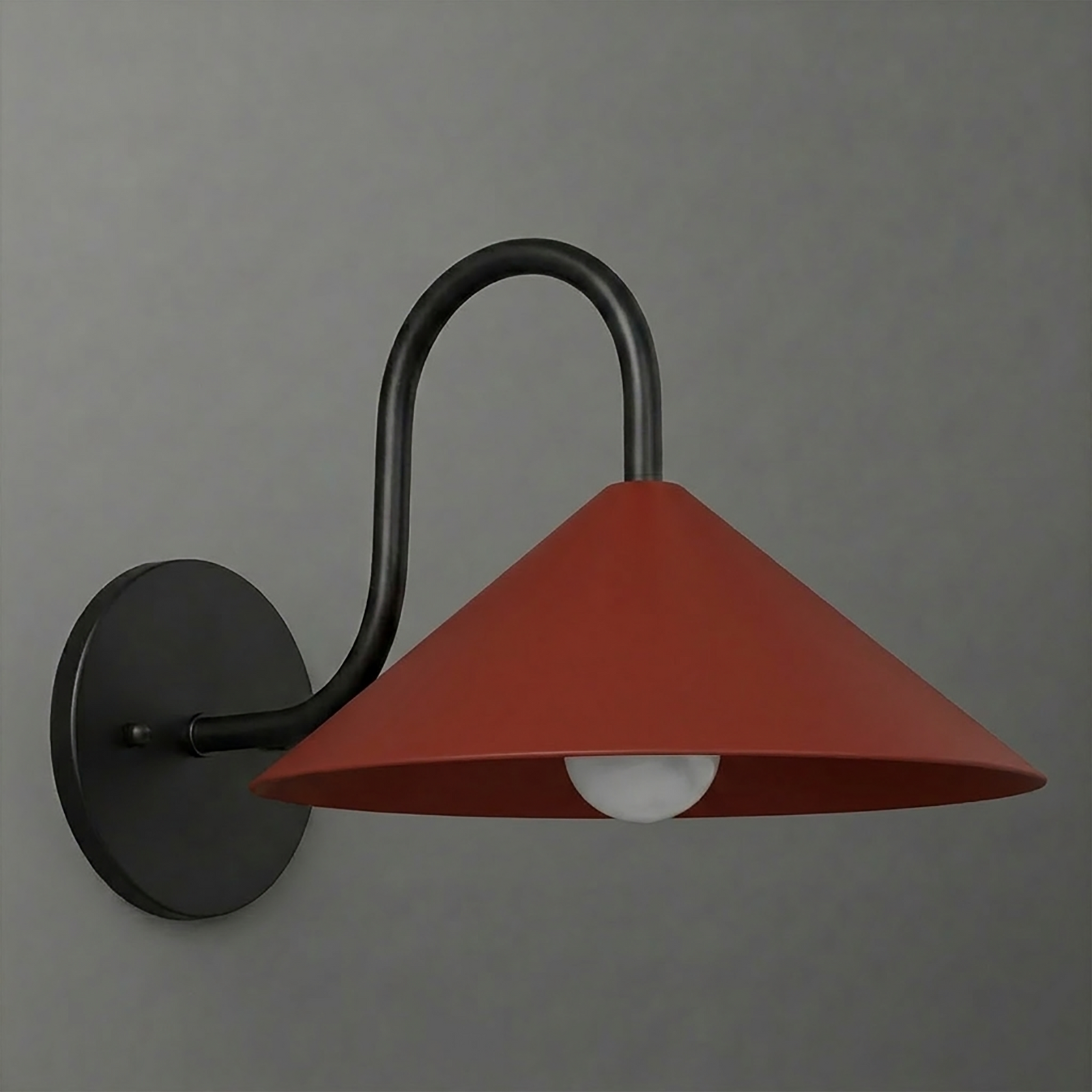 Wall sconce with matte black round base and curved arm, featuring a wide terracotta conical shade. - SCONCE MODEL NO. 1015