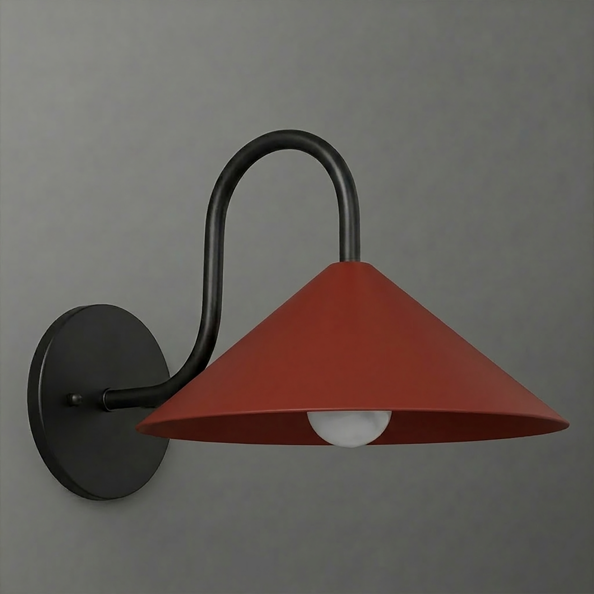 Wall sconce with matte black round base and curved arm, featuring a wide terracotta conical shade. - SCONCE MODEL NO. 1015