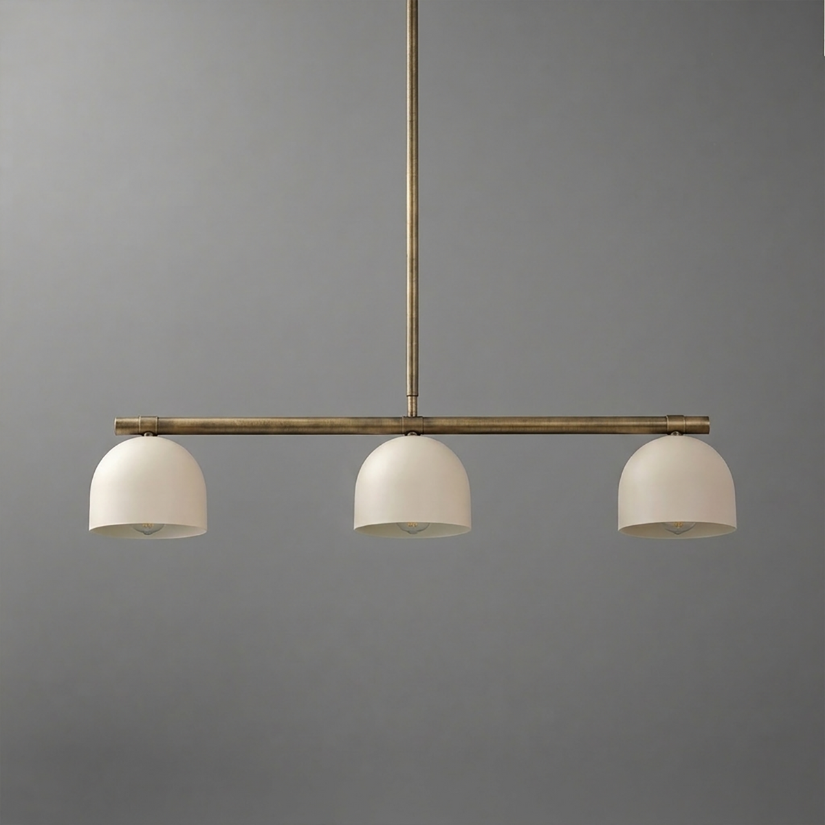 Three-bulb chandelier with matte white dome shades and a slender bronze metal frame suspension. - CHANDELIER MODEL NO. 8477