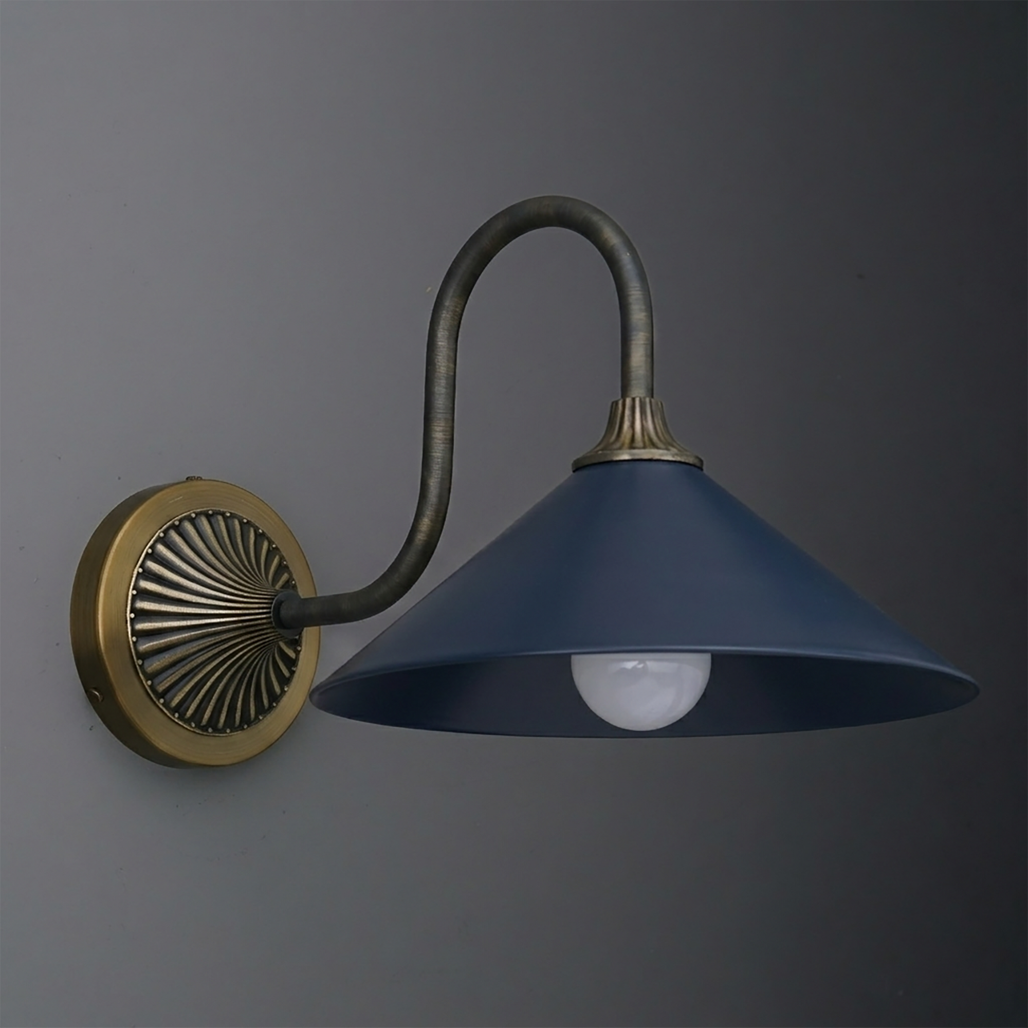 Wall-mounted metal sconce with a matte blue conical shade and antique brass arm and round backplate. - SCONCE MODEL NO. 1031