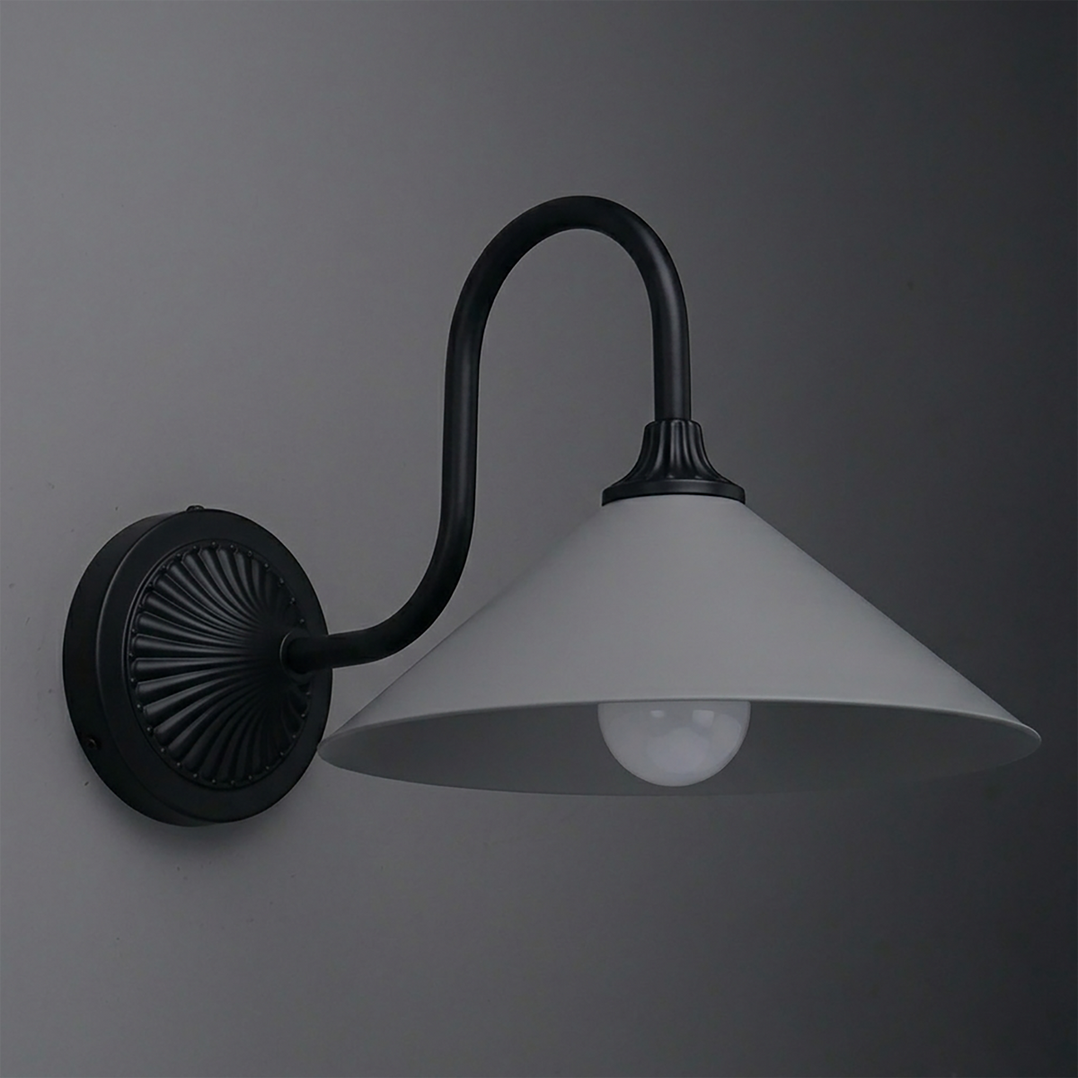 Black metal wall sconce with curved arm and wide, conical white shade housing one bulb. - SCONCE MODEL NO. 1031