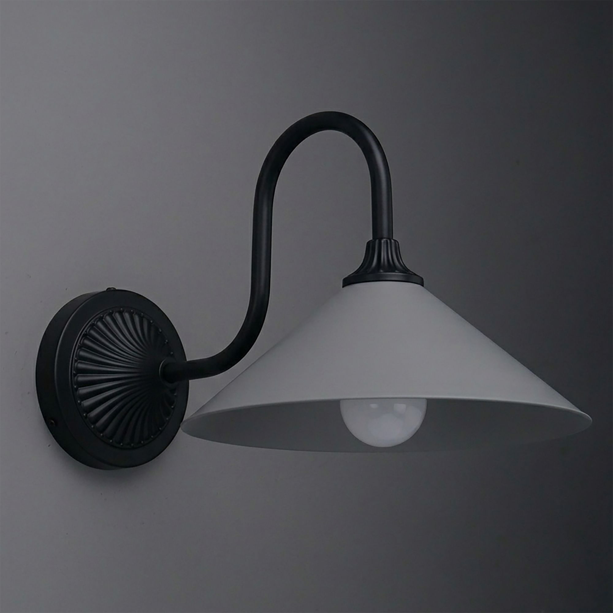 Black metal wall sconce with curved arm and wide, conical white shade housing one bulb. - SCONCE MODEL NO. 1031