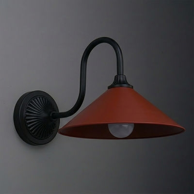 Black metal wall sconce with curved arm and wide conical rust-colored shade housing a single bulb. - SCONCE MODEL NO. 1031