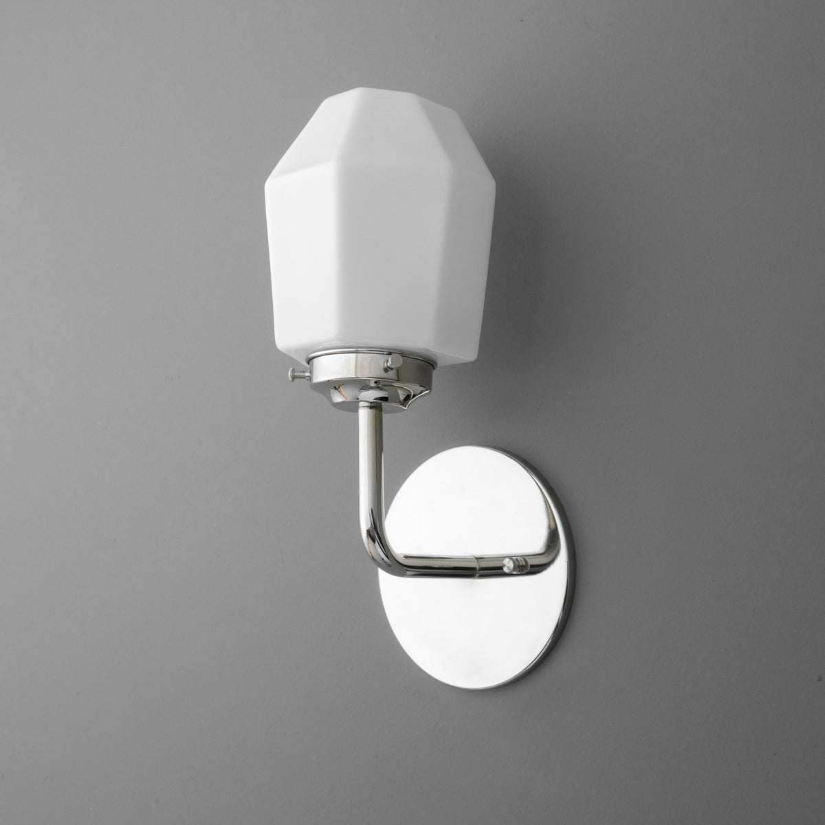 White faceted glass shade sconce with polished chrome curved arm and oval wall plate. - SCONCE MODEL NO. 1062