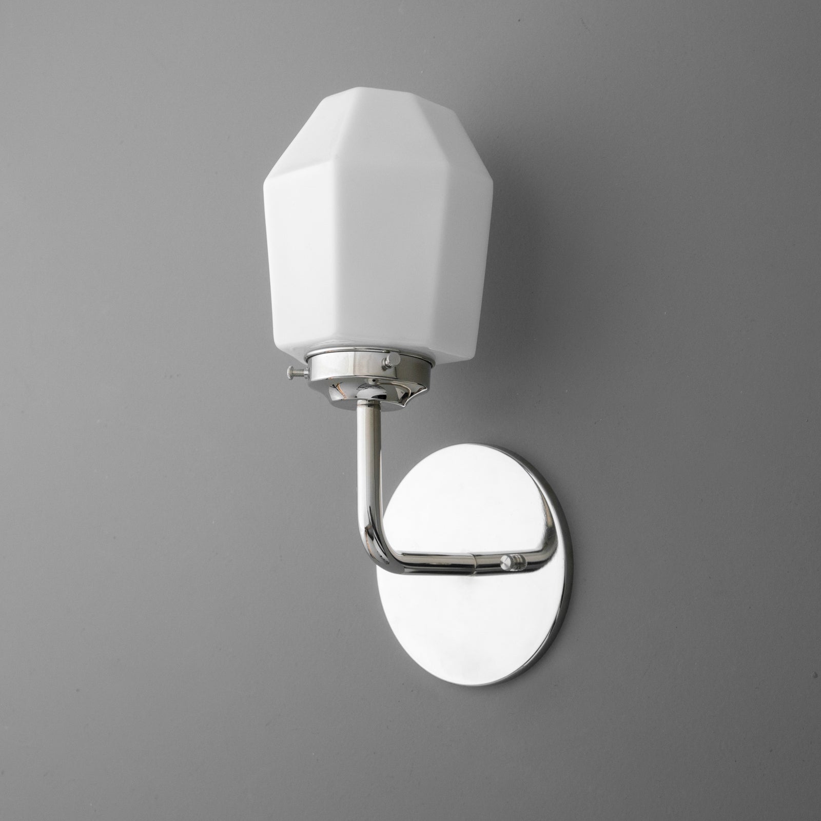 White faceted glass shade sconce with polished chrome curved arm and oval wall plate. - SCONCE MODEL NO. 1062