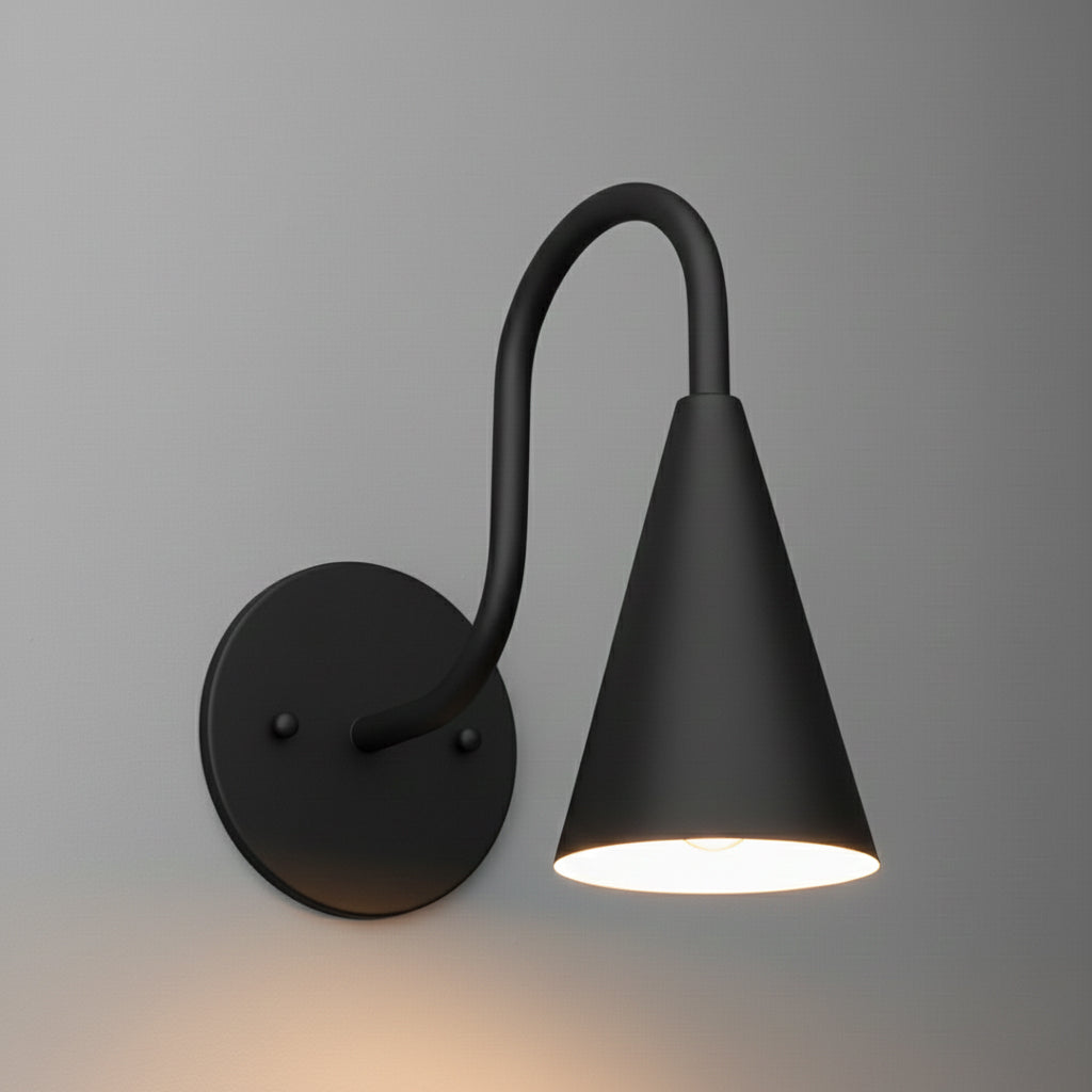 Matte black metal wall sconce with round base and curved arm holding a cone-shaped shade. - SCONCE MODEL NO. 3021