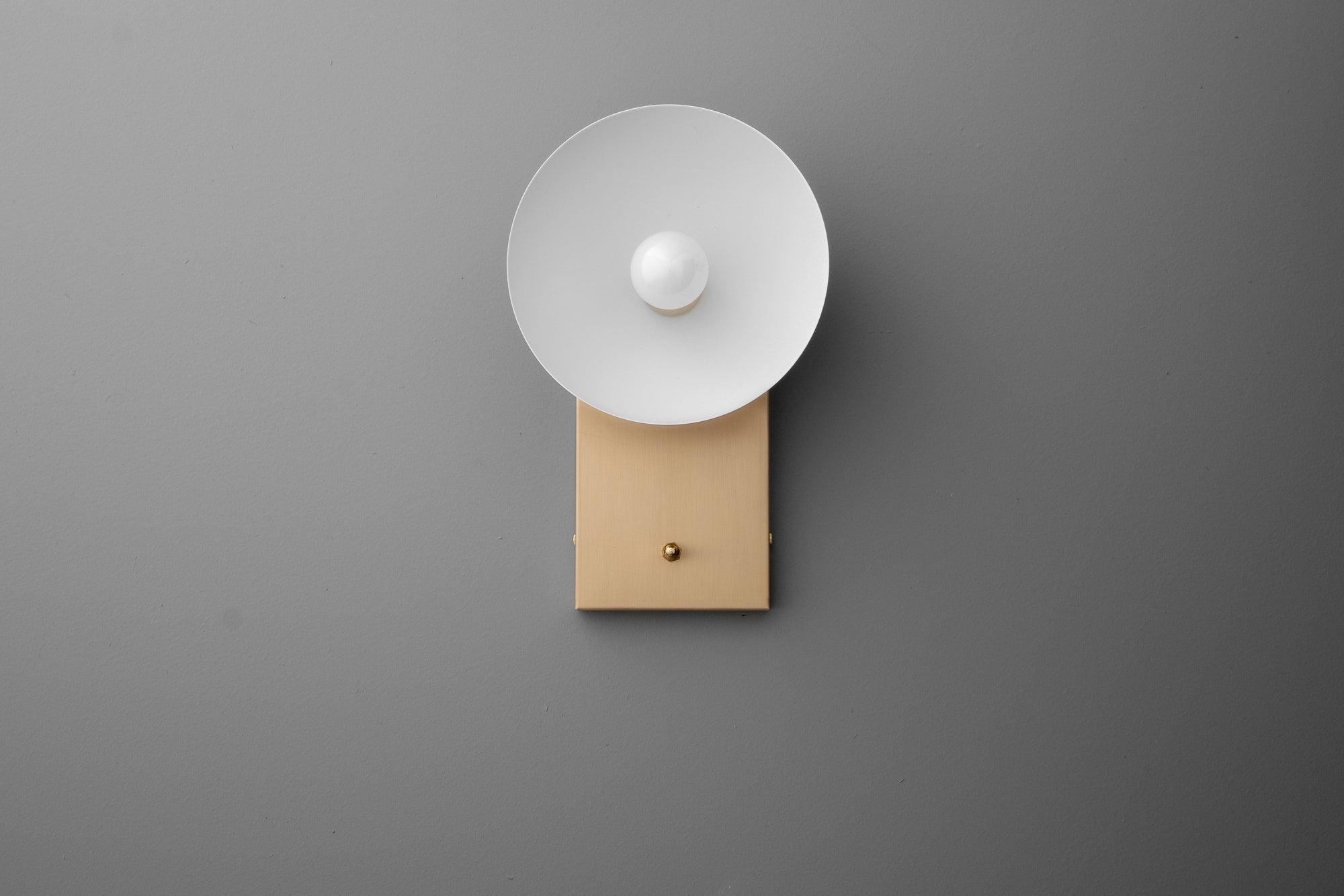 Wall-mounted sconce with a cream rectangular base and a white dome-shaped shade on a gray background. - SCONCE MODEL NO. 3357