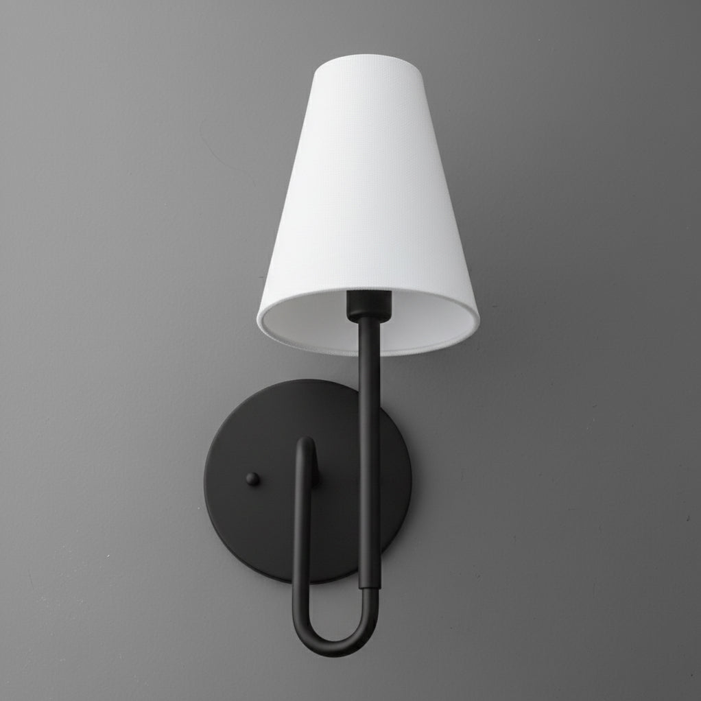 Matte black metal wall sconce with a round base and a white tapered fabric shade. - SCONCE MODEL NO. 1008