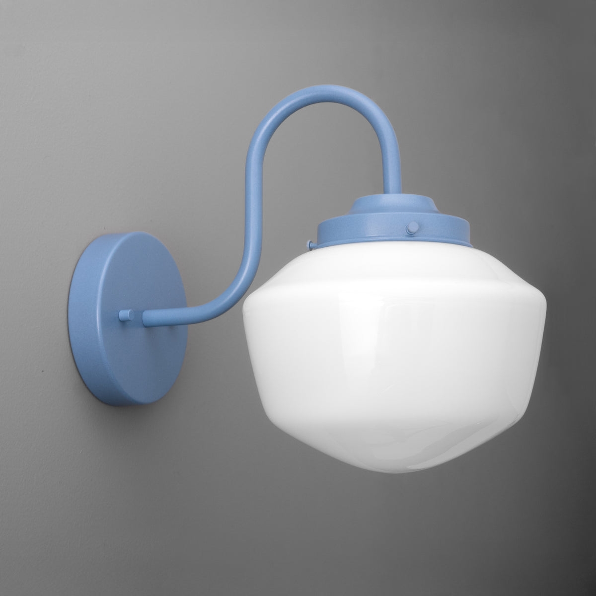 Gooseneck sconce powder coated in Periwinkle with an opal glass schoolhouse shade on a round wall plate. - SCONCE MODEL NO. 5446