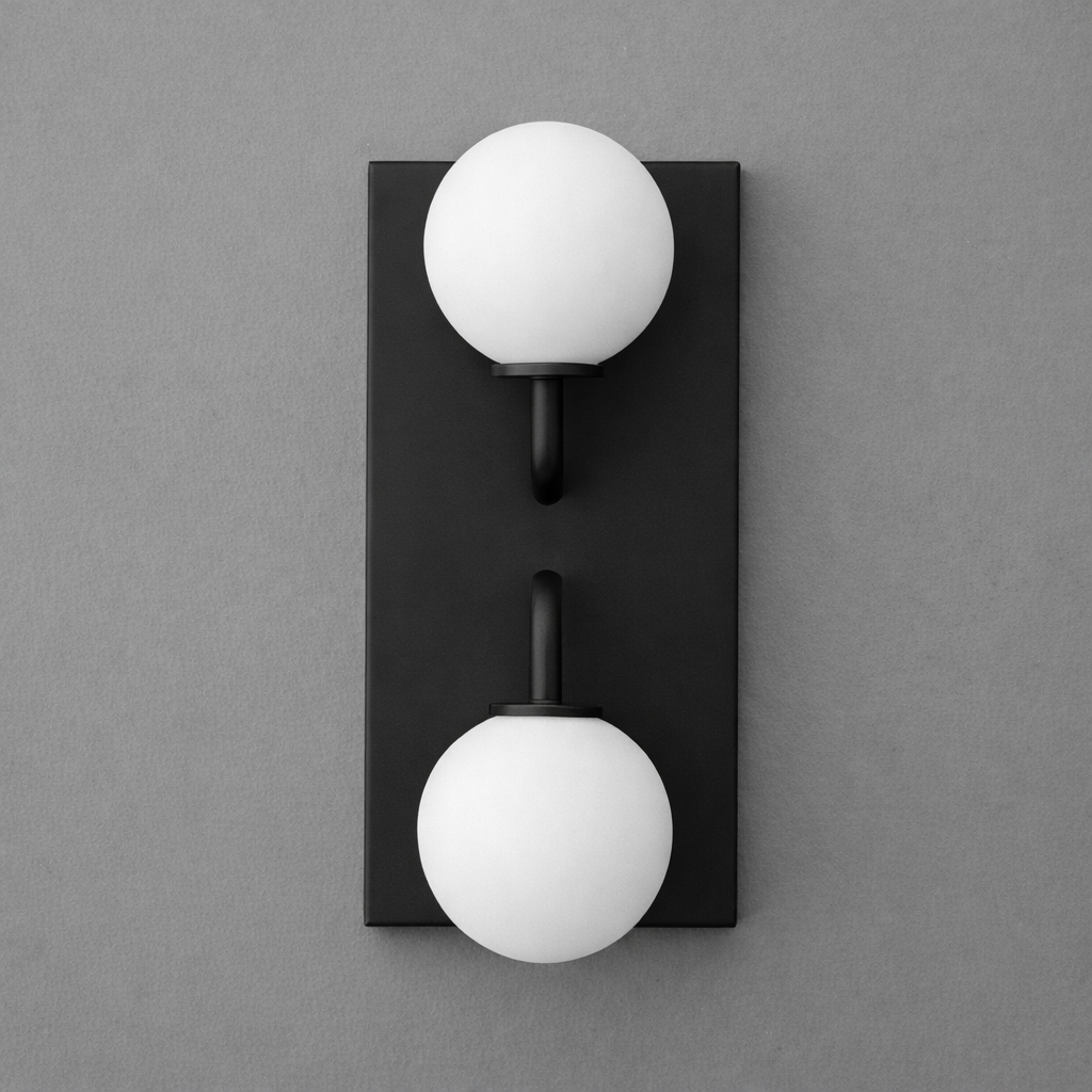 Modern black metal sconce with two white frosted glass globe shades arranged vertically. - SCONCE MODEL NO. 9868