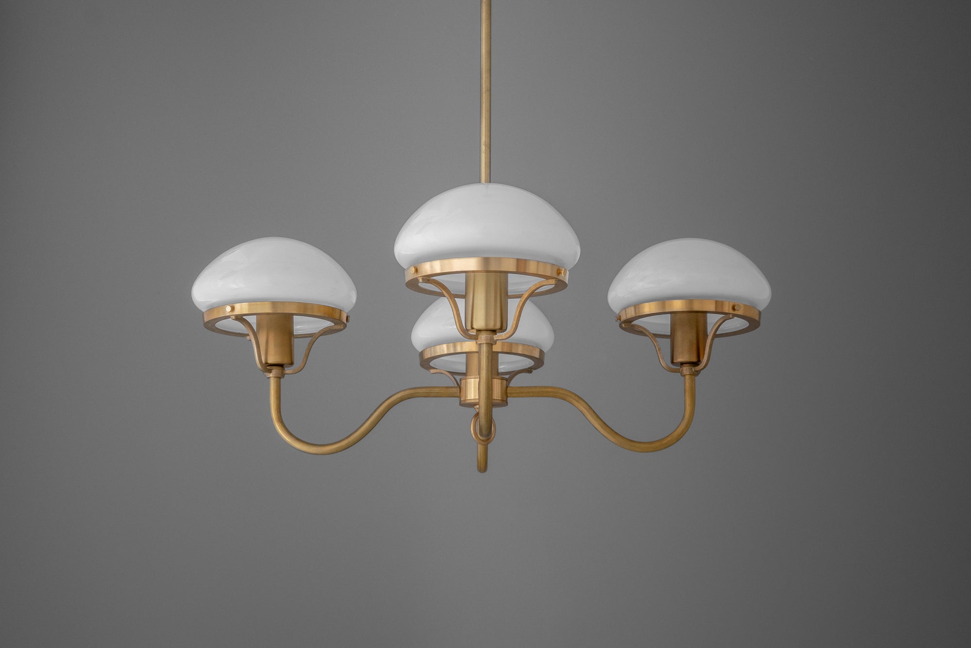 Brass chandelier with three white dome glass shades and curved arms on gray background. - CHANDELIER MODEL NO. 2136
