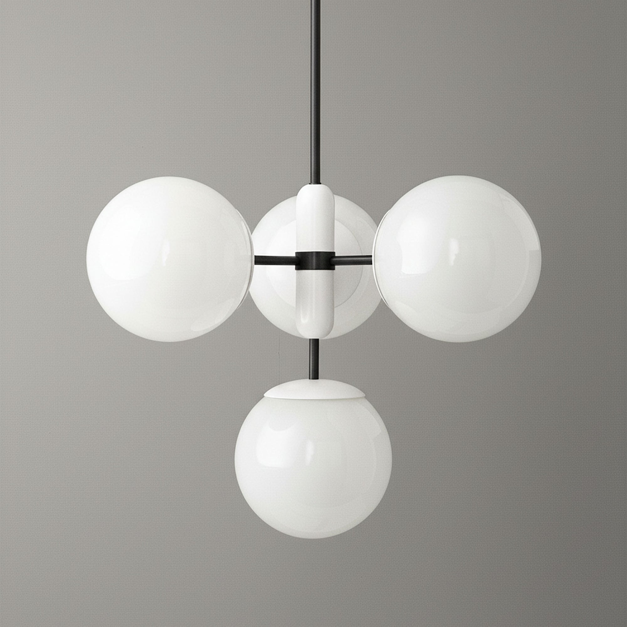 Art Deco chandelier with four white glass globes on black metal frame suspended from ceiling. - CHANDELIER MODEL NO. 4321
