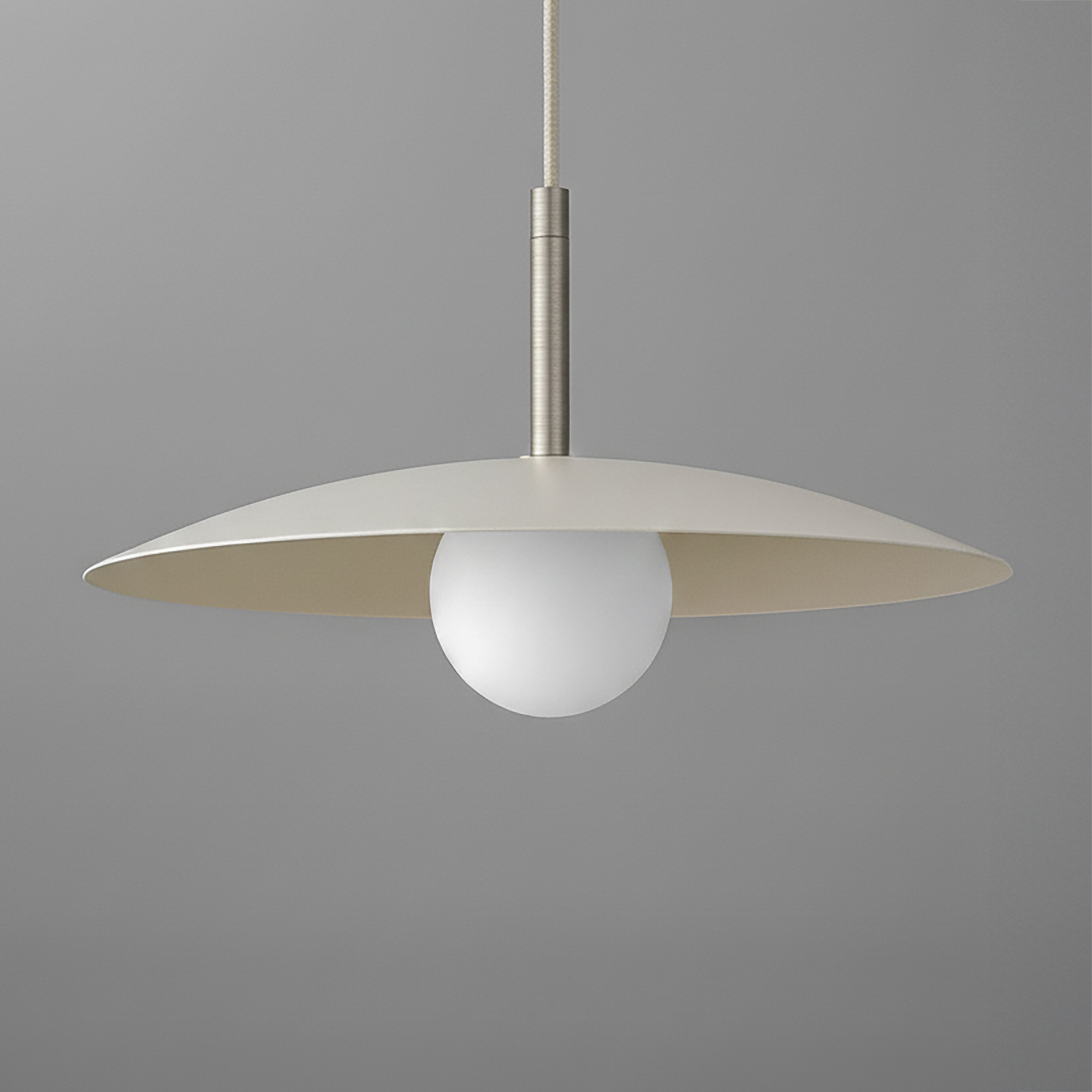 Minimal pendant light with a wide matte beige disc shade and a white globe bulb suspended by a slim metal rod. - PENDANT MODEL NO. 5693
