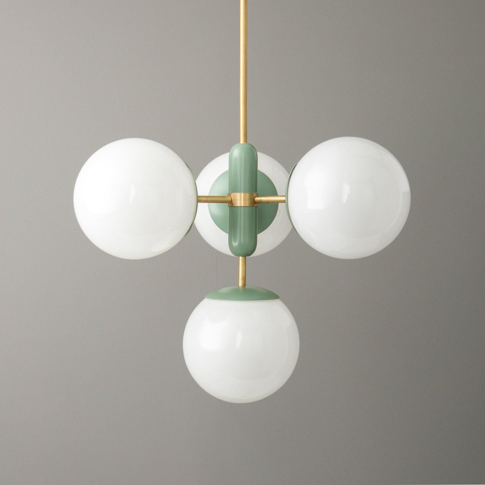 Sealed brass Art Deco chandelier with three white glass globes and green accents. - CHANDELIER MODEL NO. 4321