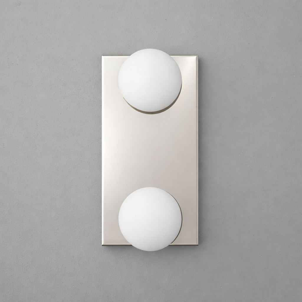 Modern wall sconce with two round white glass globes on a rectangular brushed nickel base. - SCONCE MODEL NO. 4016