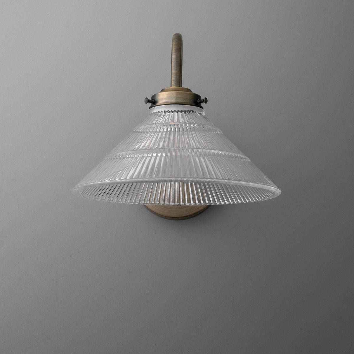 Clear ribbed glass cone-shaped sconce shade with brass mounting and single bulb fixture. - SCONCE MODEL NO. 6263