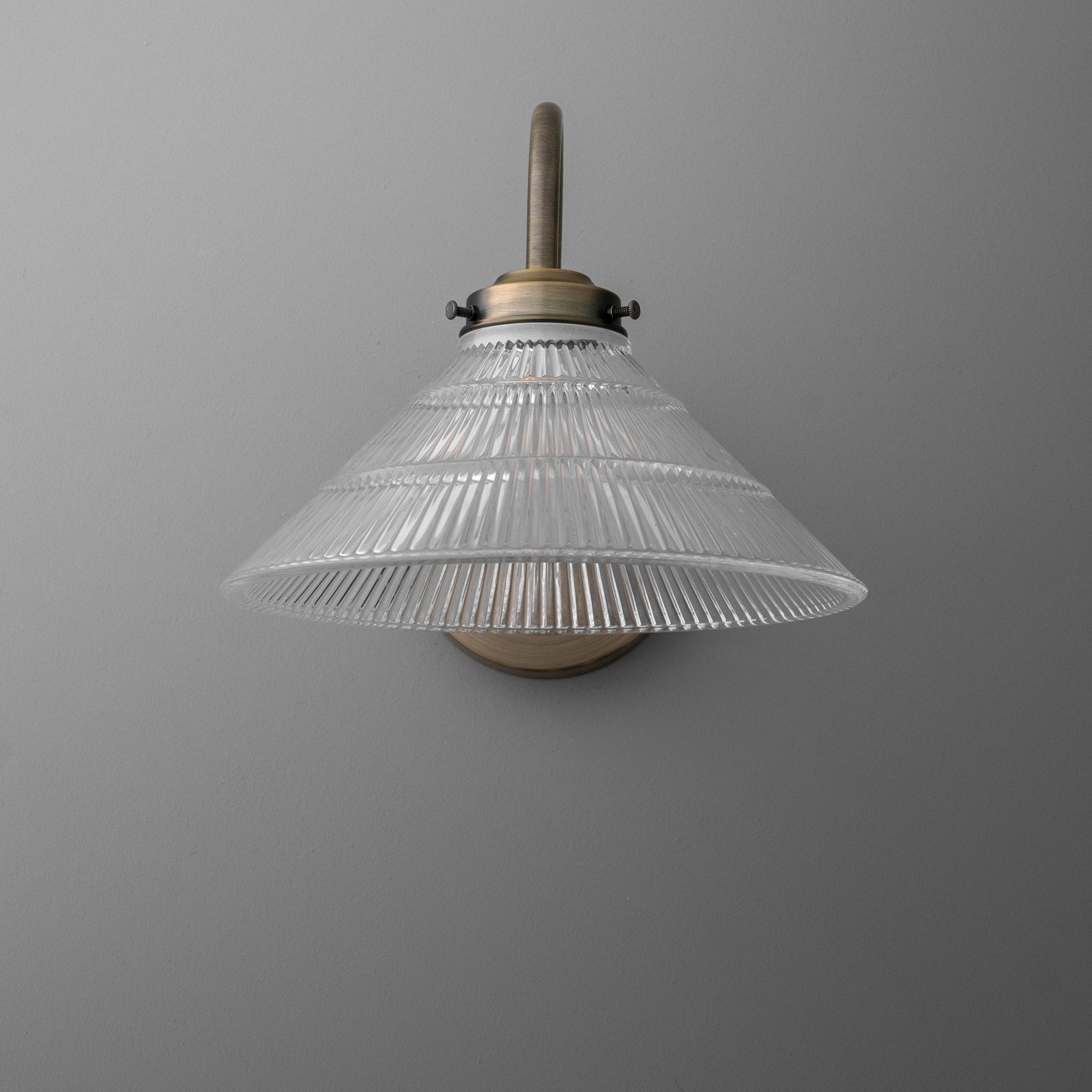 Clear ribbed glass cone-shaped sconce shade with brass mounting and single bulb fixture. - SCONCE MODEL NO. 6263