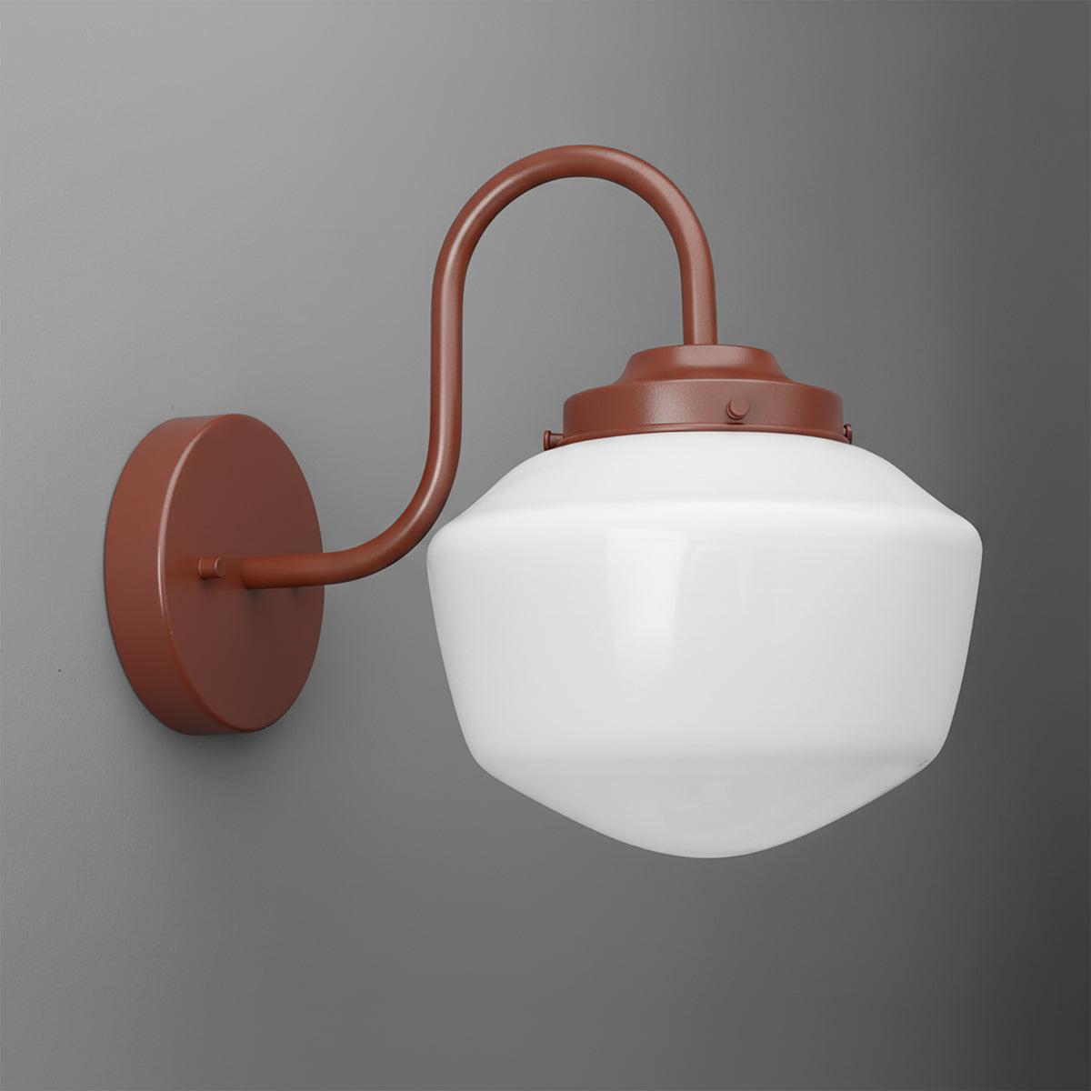 Gooseneck sconce powder coated in Brick Red with an opal glass schoolhouse shade on a round wall plate. - SCONCE MODEL NO. 5446