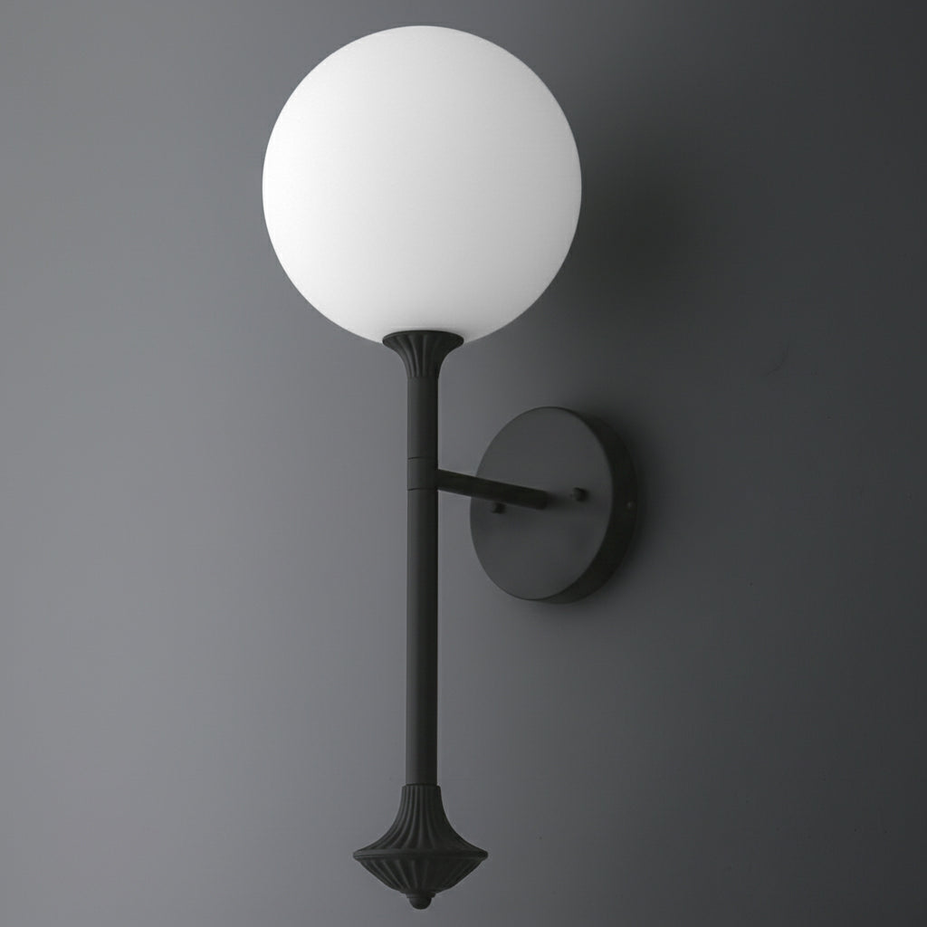 Wall-mounted sconce with a matte black metal base and round white frosted glass globe shade. - SCONCE MODEL NO. 1059