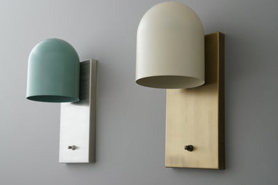 Pair of modern wall sconces with brass and nickel finishes, featuring dome-shaped cream and teal shades. - SCONCE MODEL NO. 6029