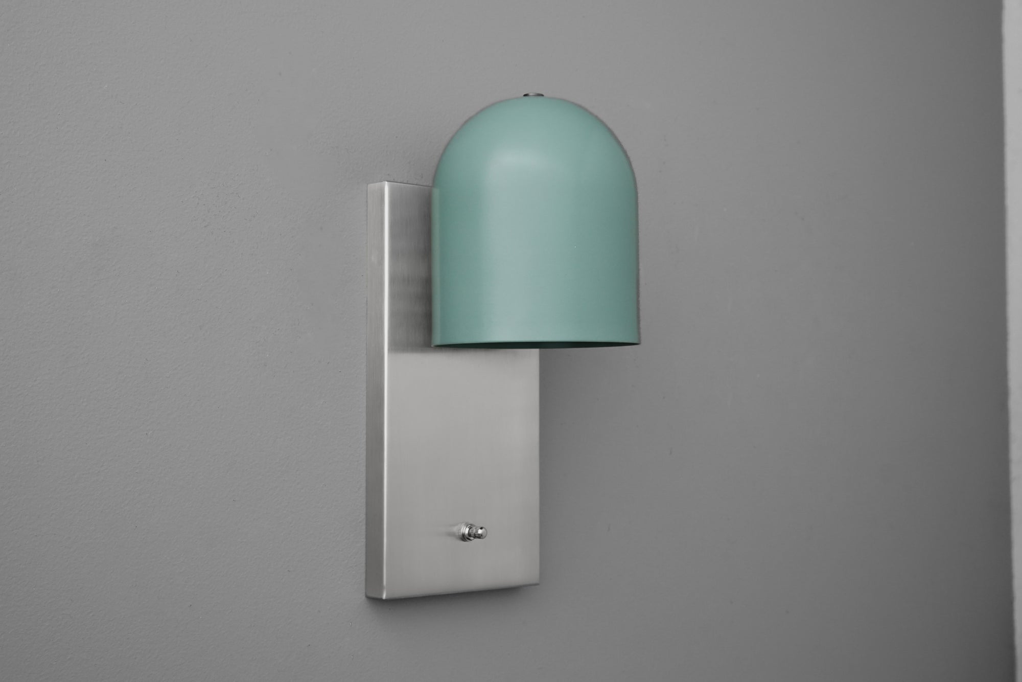 Wall sconce with matte gray rectangular base and muted teal dome-shaped shade. - SCONCE MODEL NO. 6029
