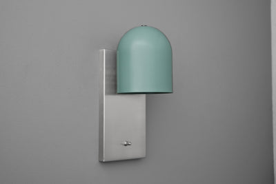 Wall sconce with matte gray rectangular base and muted teal dome-shaped shade. - SCONCE MODEL NO. 6029