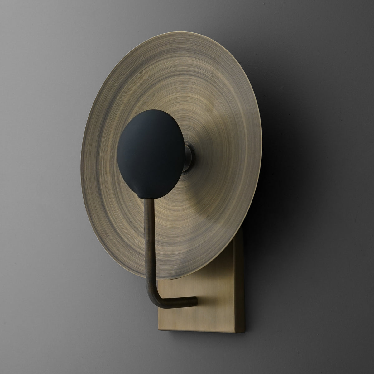 Antique brass round disc wall sconce with black bulb holder and backing plate. - SCONCE MODEL NO. 7858