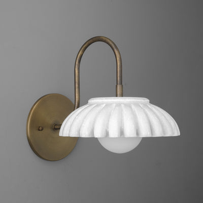 Wall sconce with fluted white glass shade and curved antique brass arm mounted on round brass backplate. - SCONCE MODEL NO. 2782