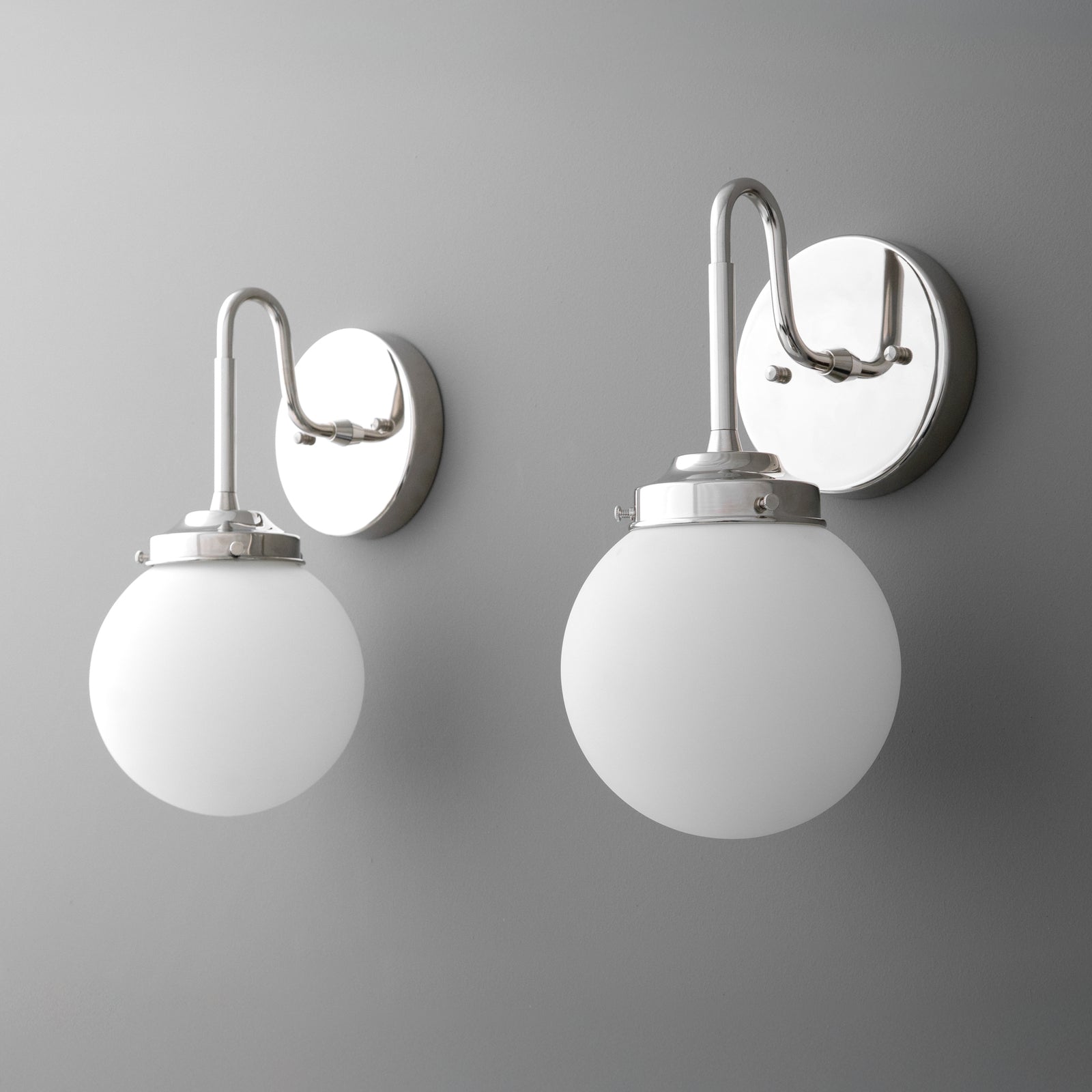 Wall-mounted sconce with polished chrome finish and frosted white glass globe shade. - SCONCE MODEL NO. 3690