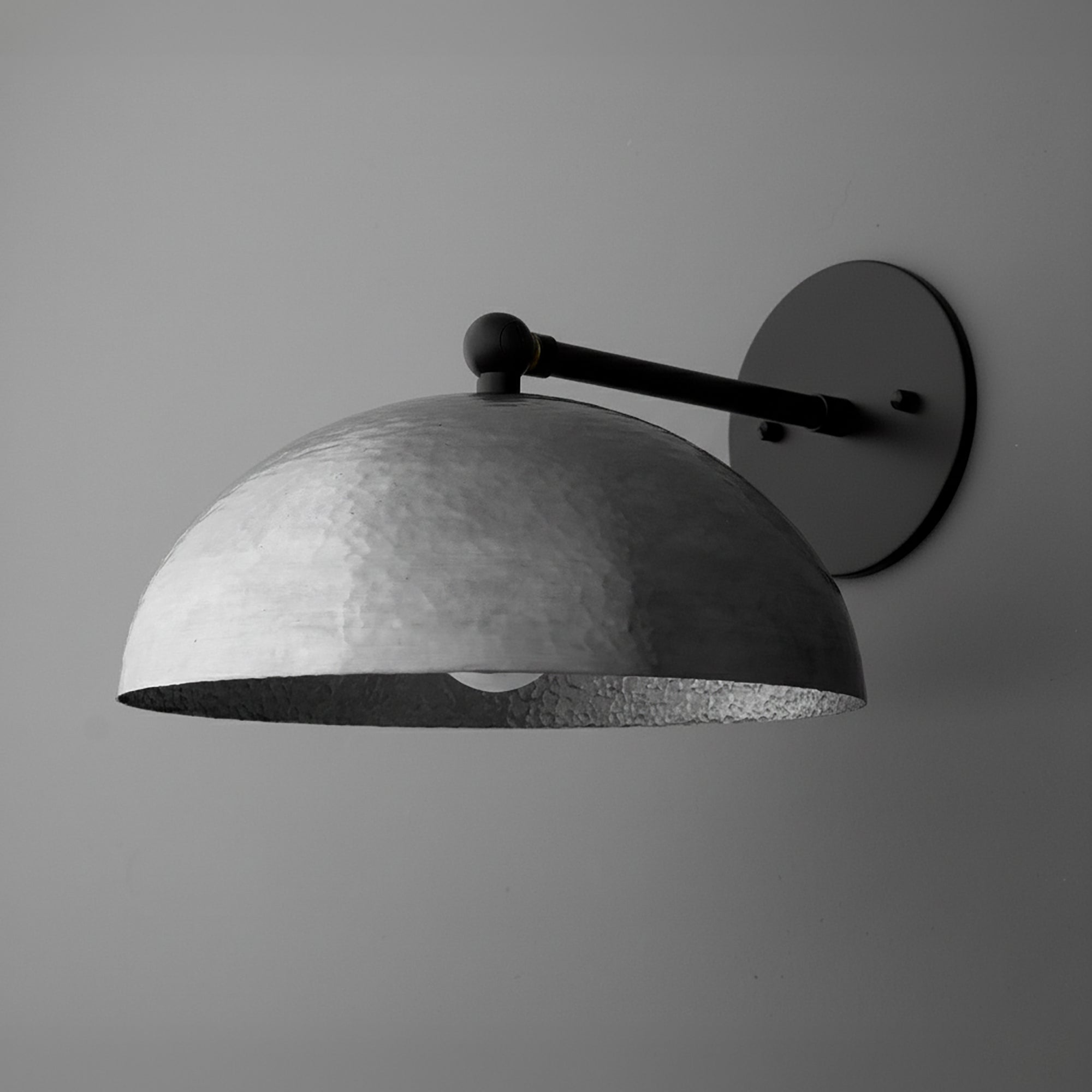 Matte black domed metal wall sconce with round backplate and minimalist arm. - SCONCE MODEL NO. 3164
