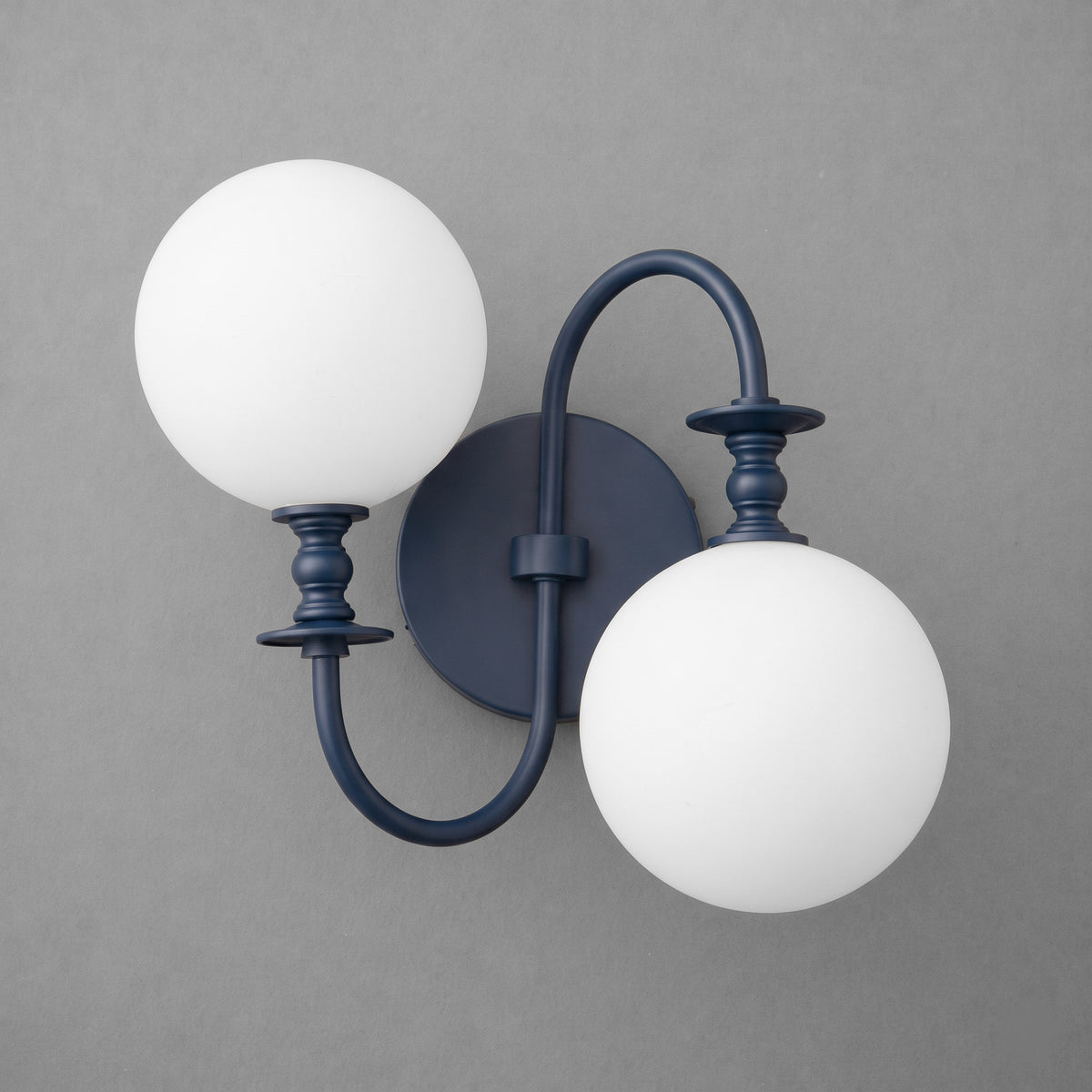 Matte black metal double-arm wall sconce with two round white frosted glass globes. - SCONCE MODEL NO. 2429