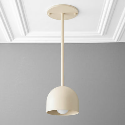 Scandinavian-style pendant light with a smooth, rounded beige metal shade and single bulb visible underneath. - PENDANT MODEL NO. 4745