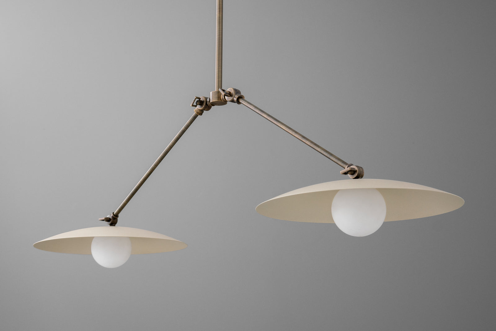 Minimalist chandelier with two flat, disc-shaped brass shades and exposed round bulbs. - CHANDELIER MODEL NO. 9799