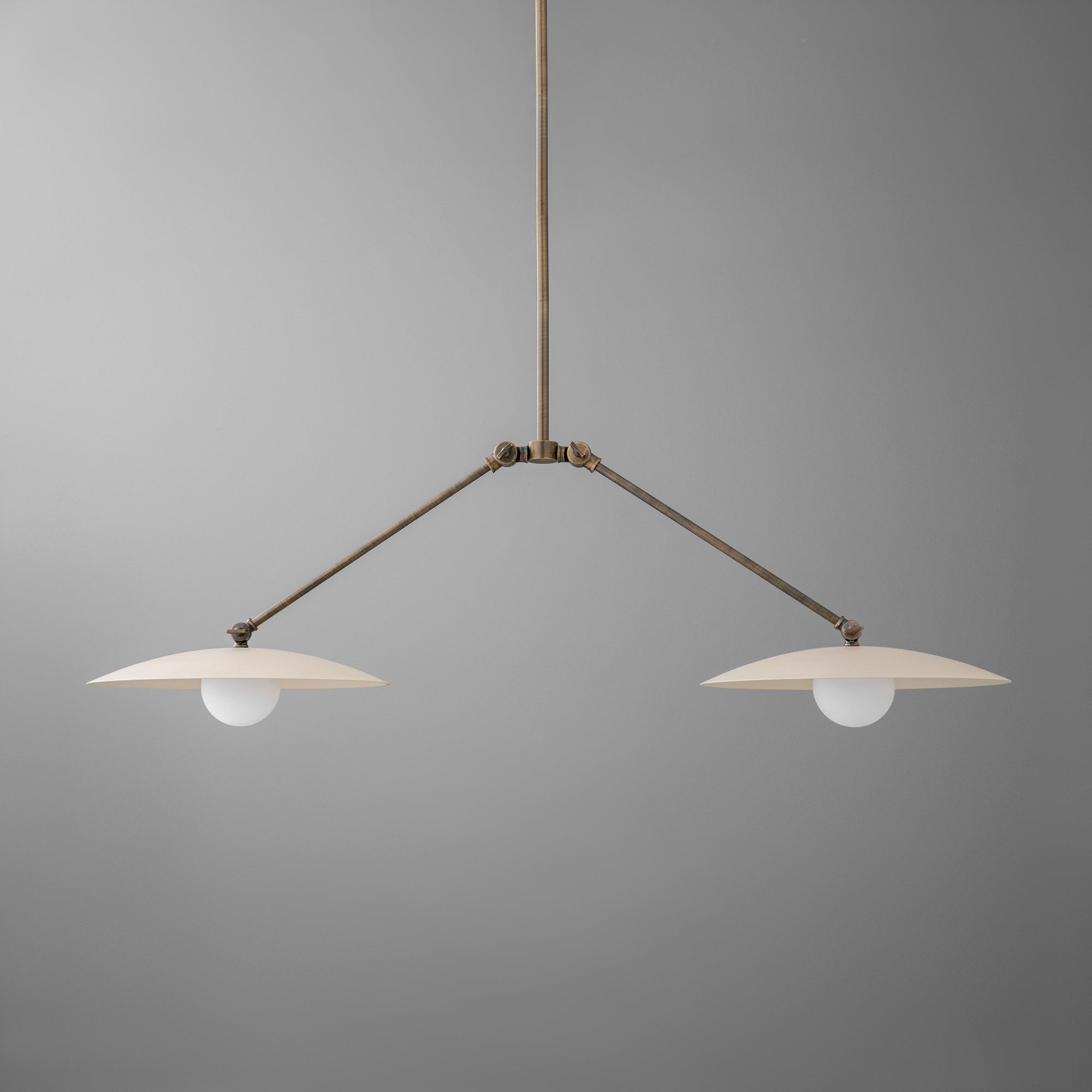 Minimalist chandelier with two white disc-shaped shades and antique brass finish suspension rods. - CHANDELIER MODEL NO. 9799