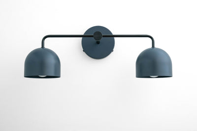 Matte dark blue metal vanity light with two dome-shaped shades and a circular wall mount. - VANITY LIGHT MODEL NO. 2082