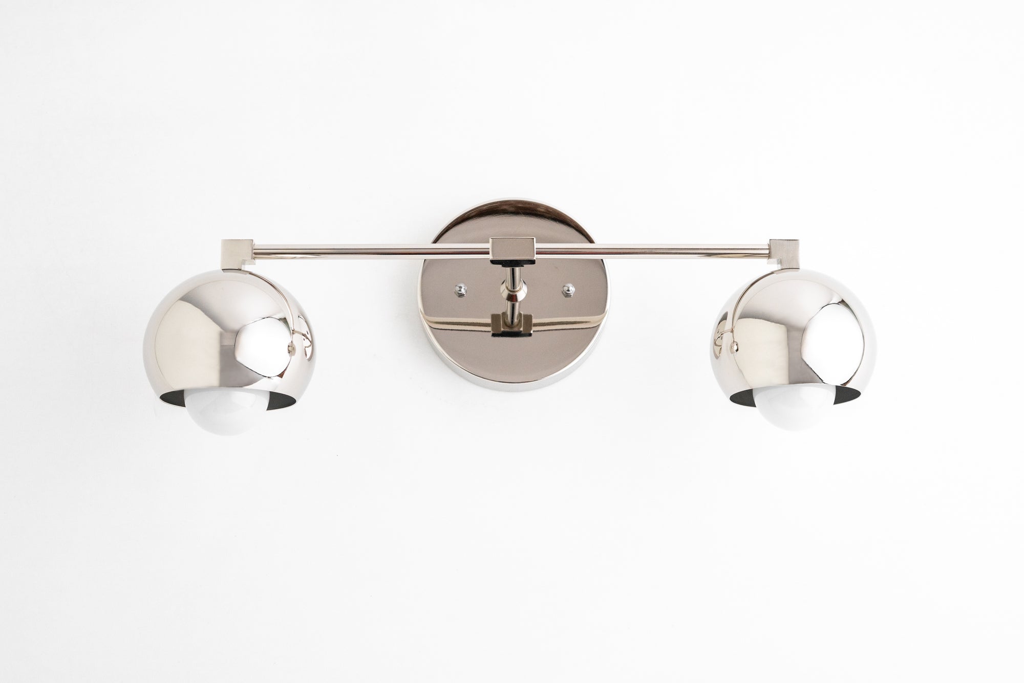 Brushed nickel double vanity light with round shades and sleek mid-century modern design. - VANITY LIGHT MODEL NO. 5469