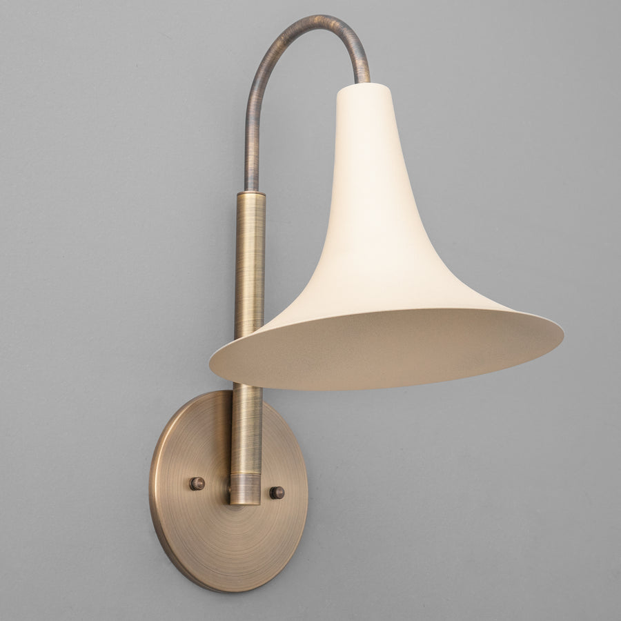 Antique brass wall sconce with curved arm and cream flared metal shade. - SCONCE MODEL NO. 3851