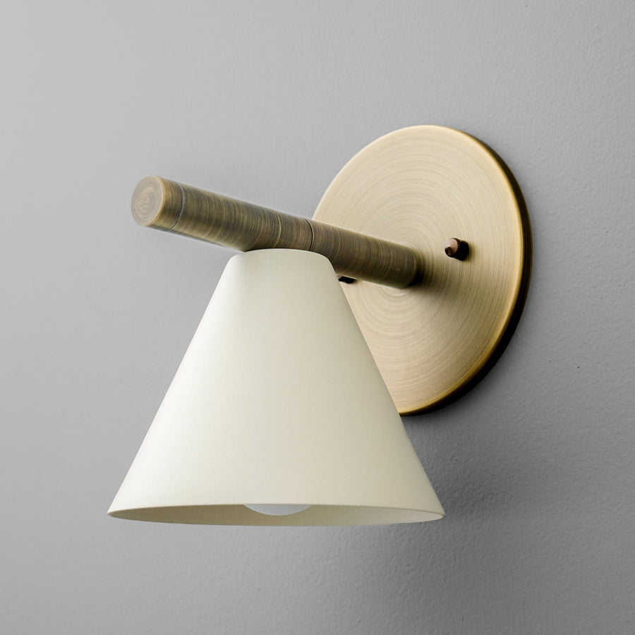 Wall sconce with antique brass round base and cylindrical arm, cream conical metal shade. - SCONCE MODEL NO. 5075