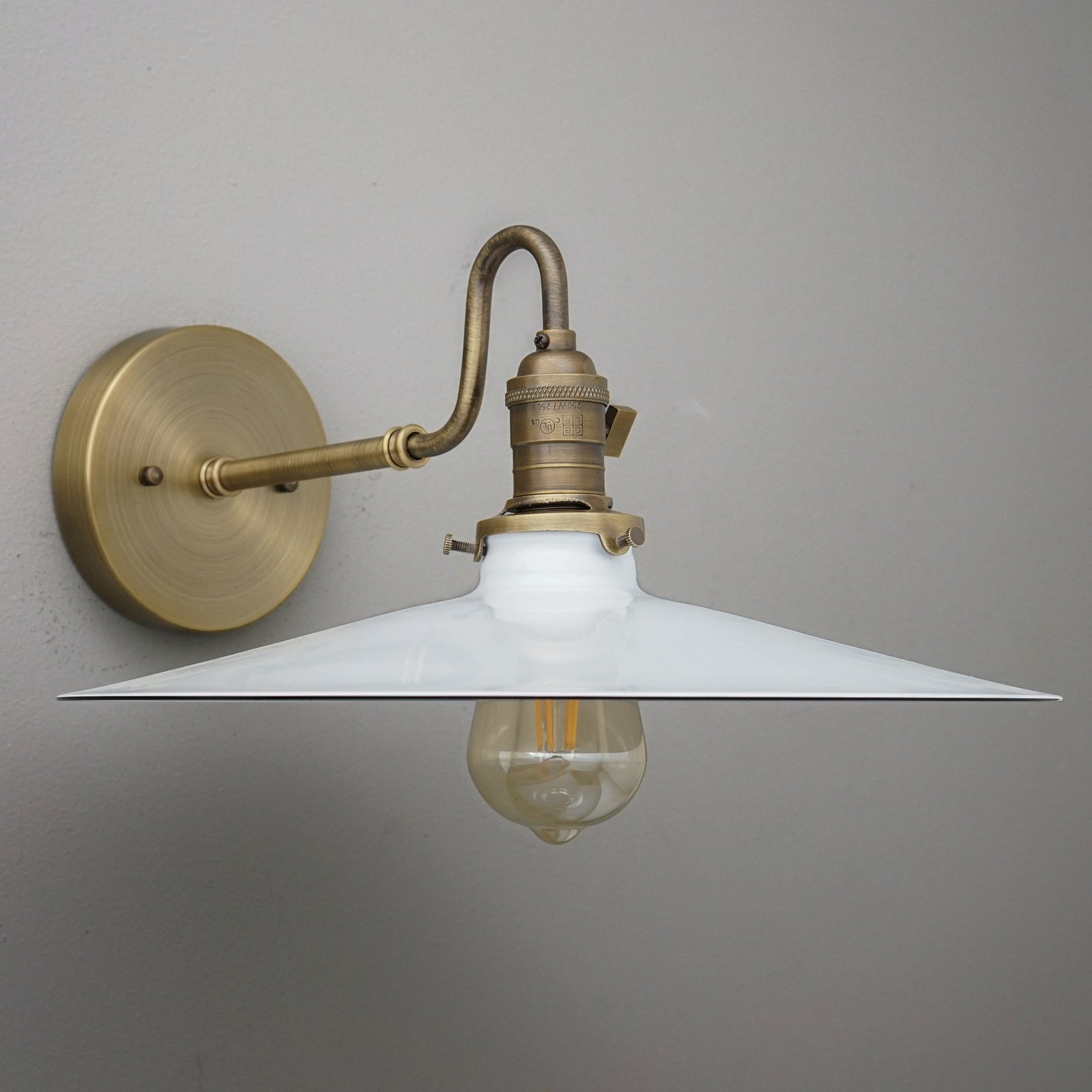 Wall-mounted sconce with antique brass finish and wide white conical metal shade, vintage exposed bulb. - SCONCE MODEL NO. 5562