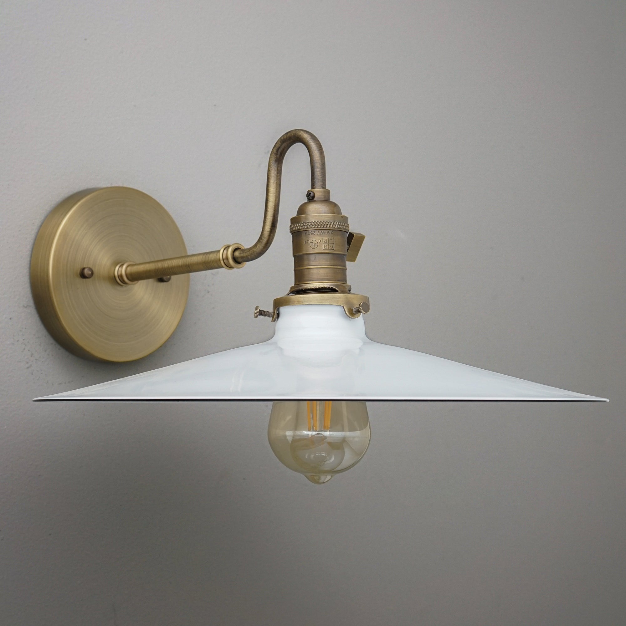 Wall-mounted sconce with antique brass finish and wide white conical metal shade, vintage exposed bulb. - SCONCE MODEL NO. 5562