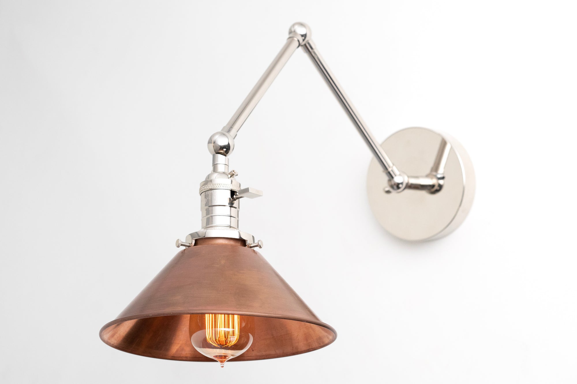 Adjustable wall sconce with brushed nickel arm and copper cone shade, industrial style. - SCONCE MODEL NO. 6668