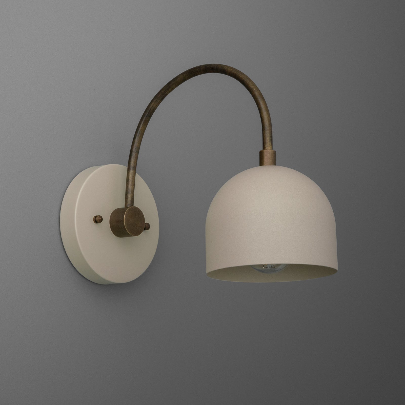 Matte white dome shade with brass finish curved arm and round wall mount semi-flush sconce. - SCONCE MODEL NO. 8586
