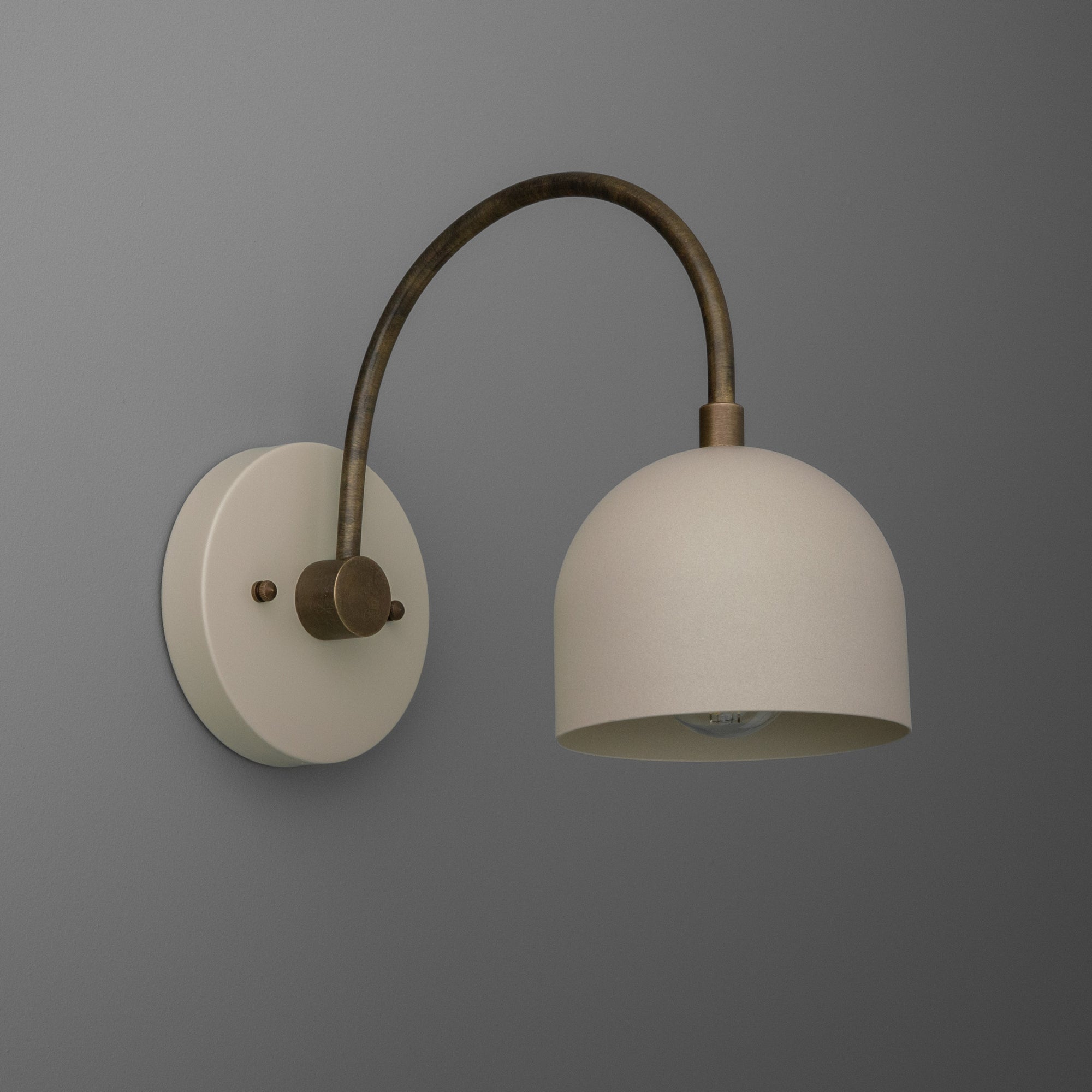 Matte white dome shade with brass finish curved arm and round wall mount semi-flush sconce. - SCONCE MODEL NO. 8586