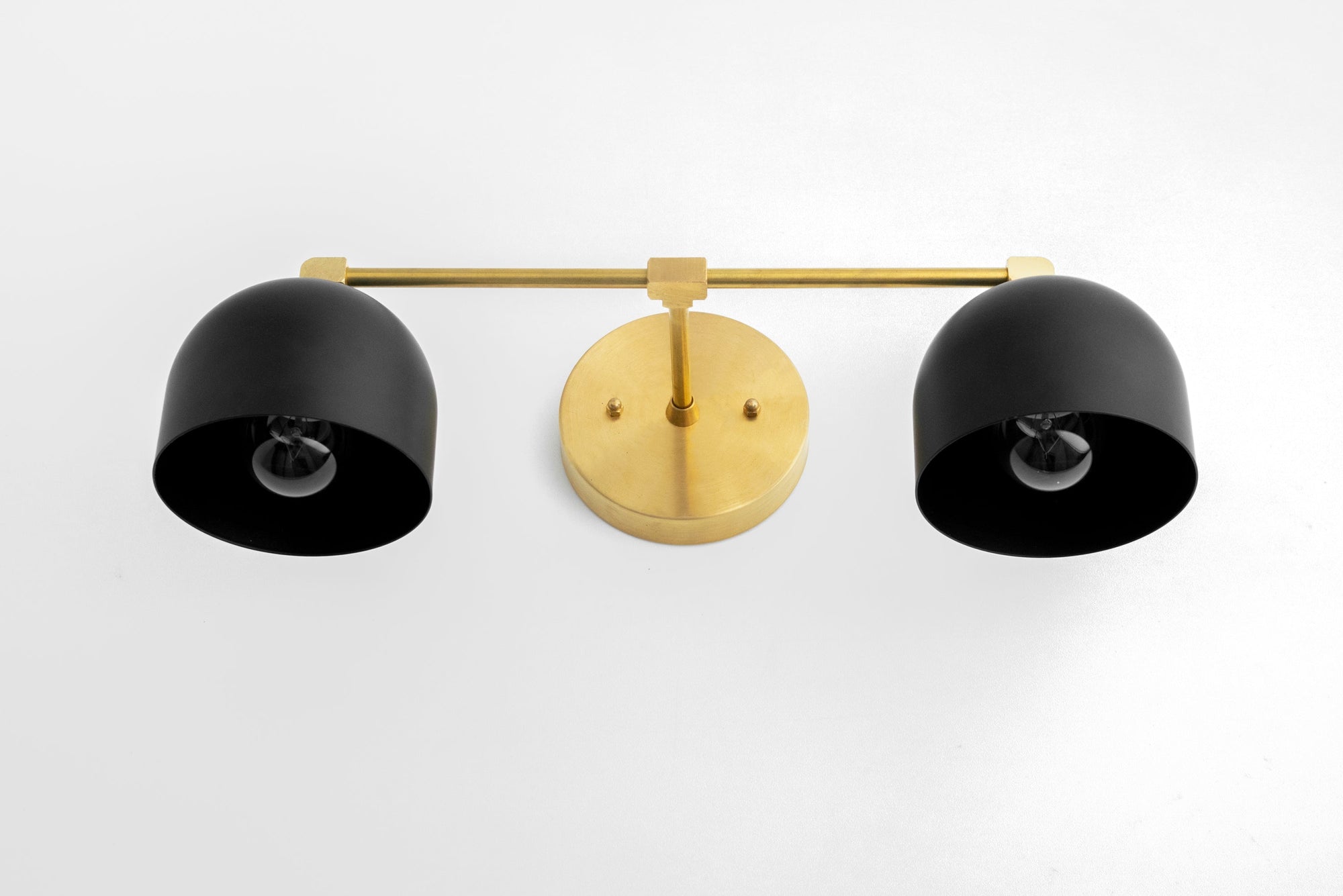 Mid-century modern 2-bulb vanity light in black shades with brass accents and round wall mount. - VANITY LIGHT MODEL NO. 0698