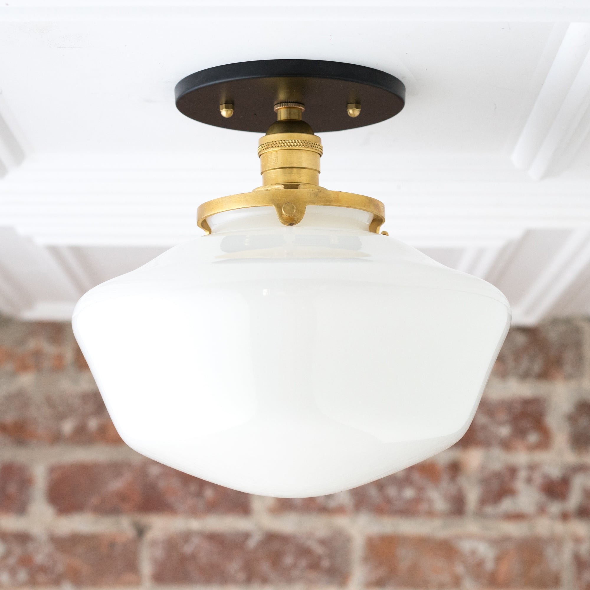 Mid-century modern semi-flush ceiling light with white glass globe and brass fixture on black mount. - CEILING LIGHT MODEL NO. 5754