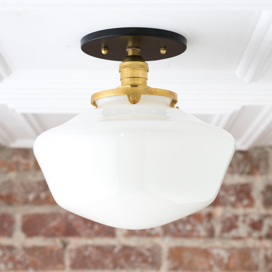 Mid-century modern semi-flush ceiling light with white glass globe and brass fixture on black mount. - CEILING LIGHT MODEL NO. 5754