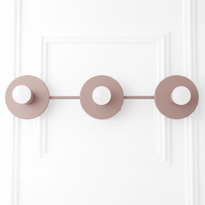 Mid-century modern mauve vanity light with three bare round bulb sockets on straight horizontal bar. - VANITY LIGHT MODEL NO. 5708